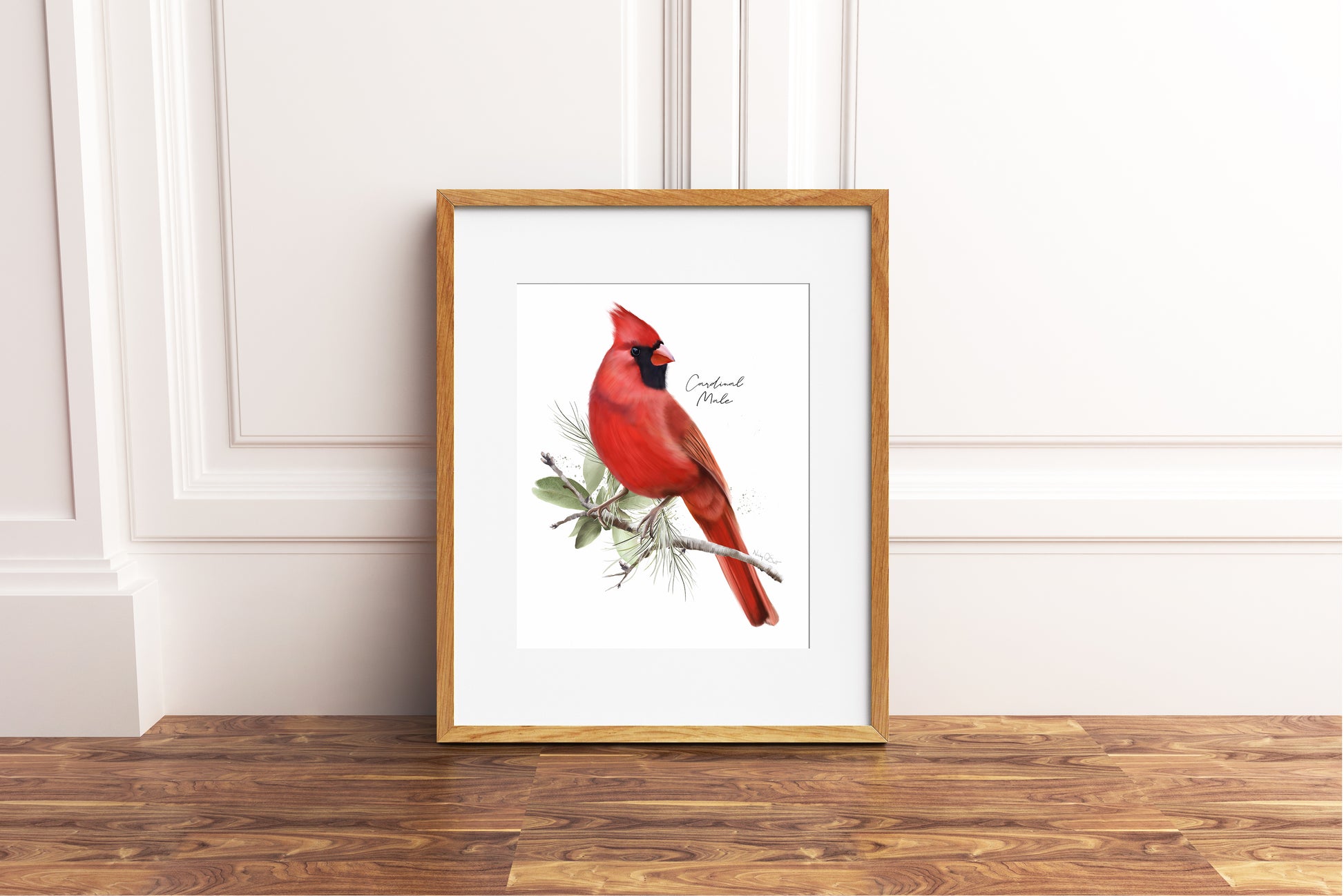 Framed artwork of a red cardinal bird on a white background
