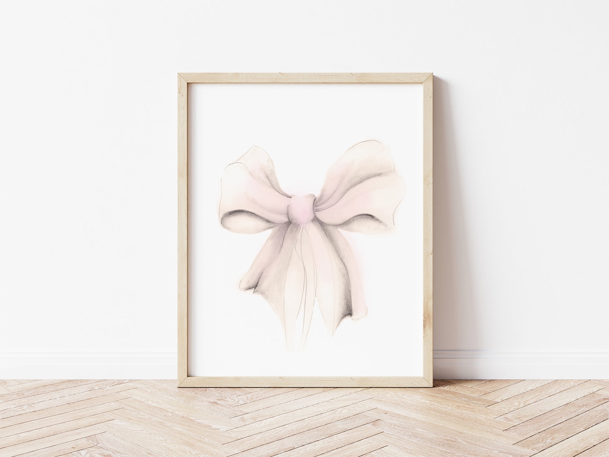 Sketch of a bow in tones of pink and sepia beige. The bow is on a plain white background and is framed in a wood frame that sits on a wood floor - Studio Q - Art by Nicky Quartermaine Scott