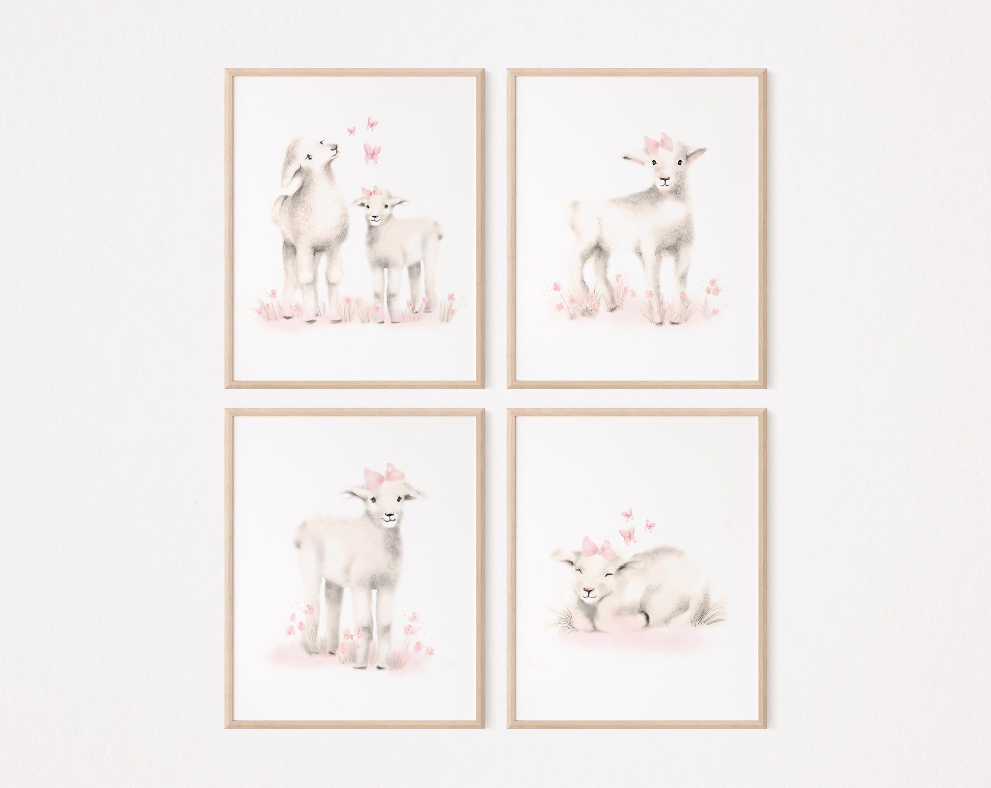 Set of 4 lamb prints from drawings in tones of sepia beige and blush pink. Lambs have pink flowers, bows and butterflies around them. The prints are on a white background and are framed in light wood frames.  The set hangs against a plain light pink background - Studio Q - Art by Nicky Quartermaine Scott